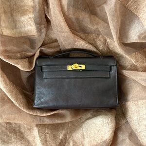 HERMÈS Ebene Kelly Pochette Evergrain GHW